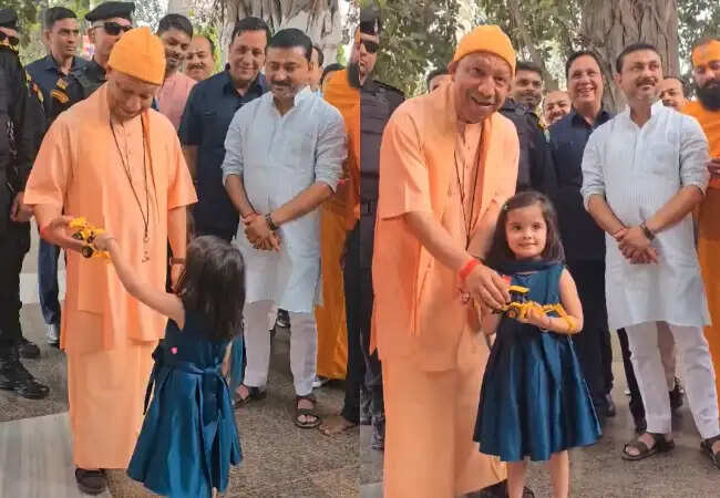 सीएम योगी को बच्ची ने भेंट किया खिलौना बुलडोजर, चर्चा का विषय बना