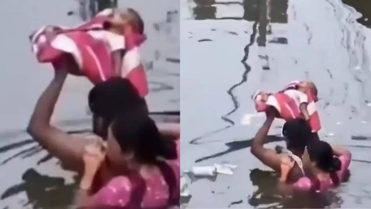 Prayagraj में बाढ़ का कहर: नवजात के साथ दंपत्ति की दर्दनाक तस्वीरें वायरल