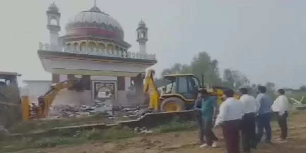 Bulldozer runs on illegal tomb built on government land in Haridwar